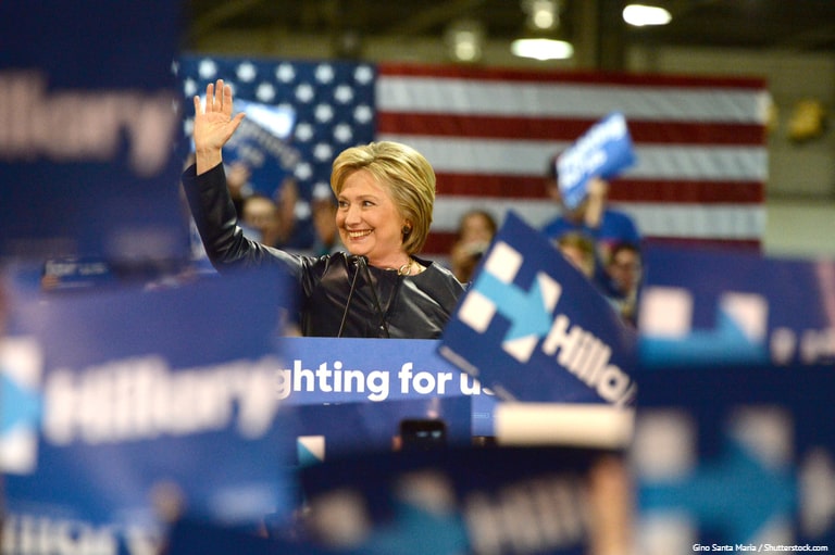 Hillary Clinton waving at a campaign rally in 2016