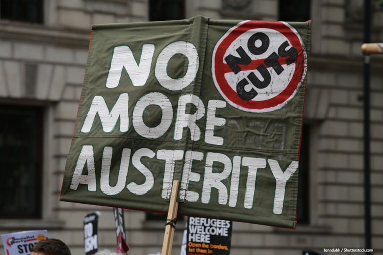 Sign being held up reading "no more austerity"